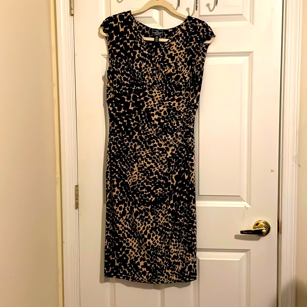 Size 10 amazing dress beige and black print. Amazing fit. Underneath black slip.